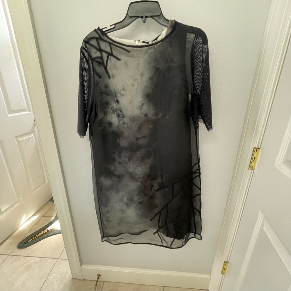 T Tahari size 12.  Sleeves shift with light weight over dress.